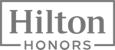 The image shows the Hilton Honors logo, featuring the word "Hilton" in large text and "HONORS" below it in smaller text within a rectangular frame.